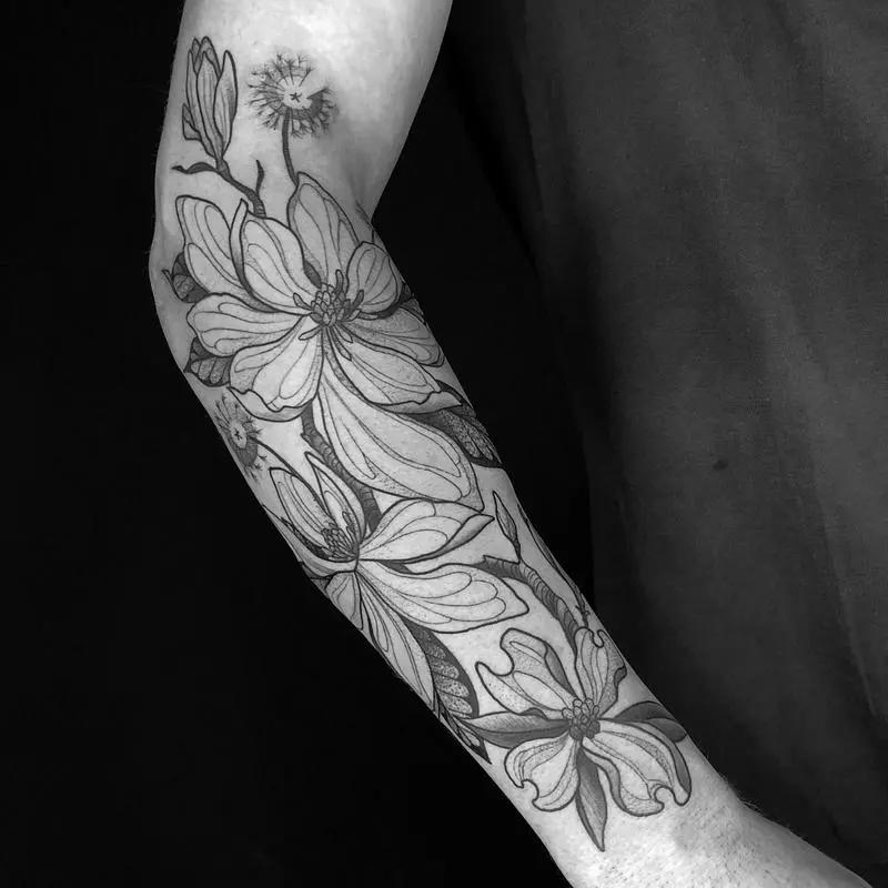 a flower tattoo at the forearm