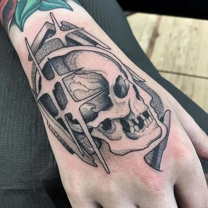 a skull tattoo at the arm