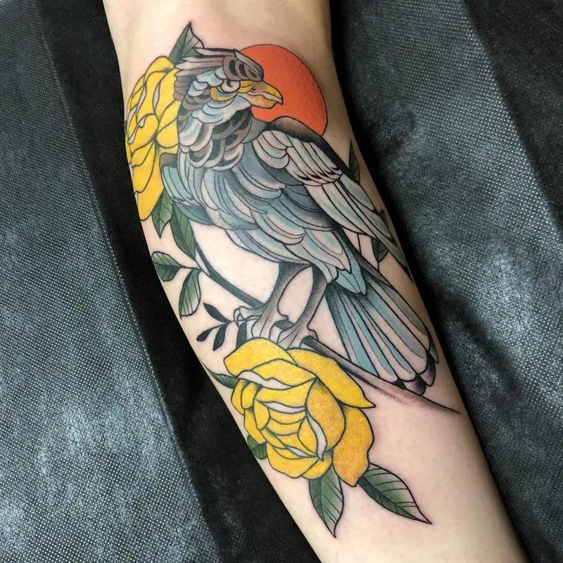 a bird tattoo in the arm