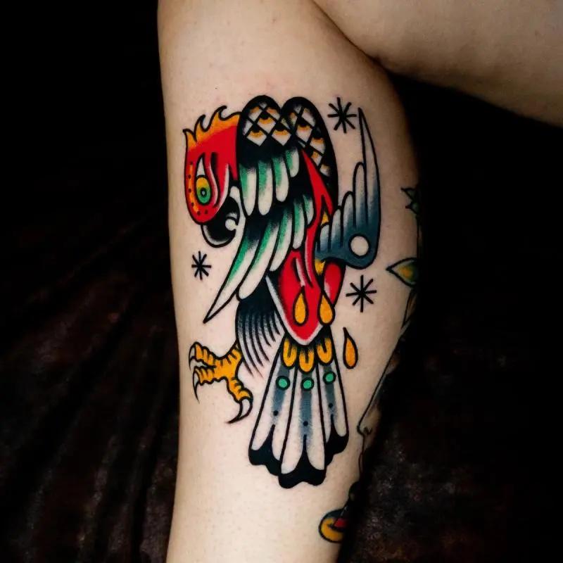 a bird flying tattoo