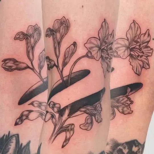 a flower tattoo on a person's arm