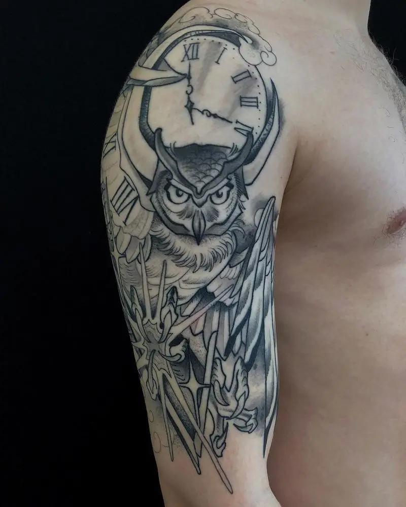 an owl tattoo at the arm