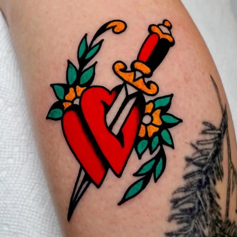 a heart and a knife tattoo