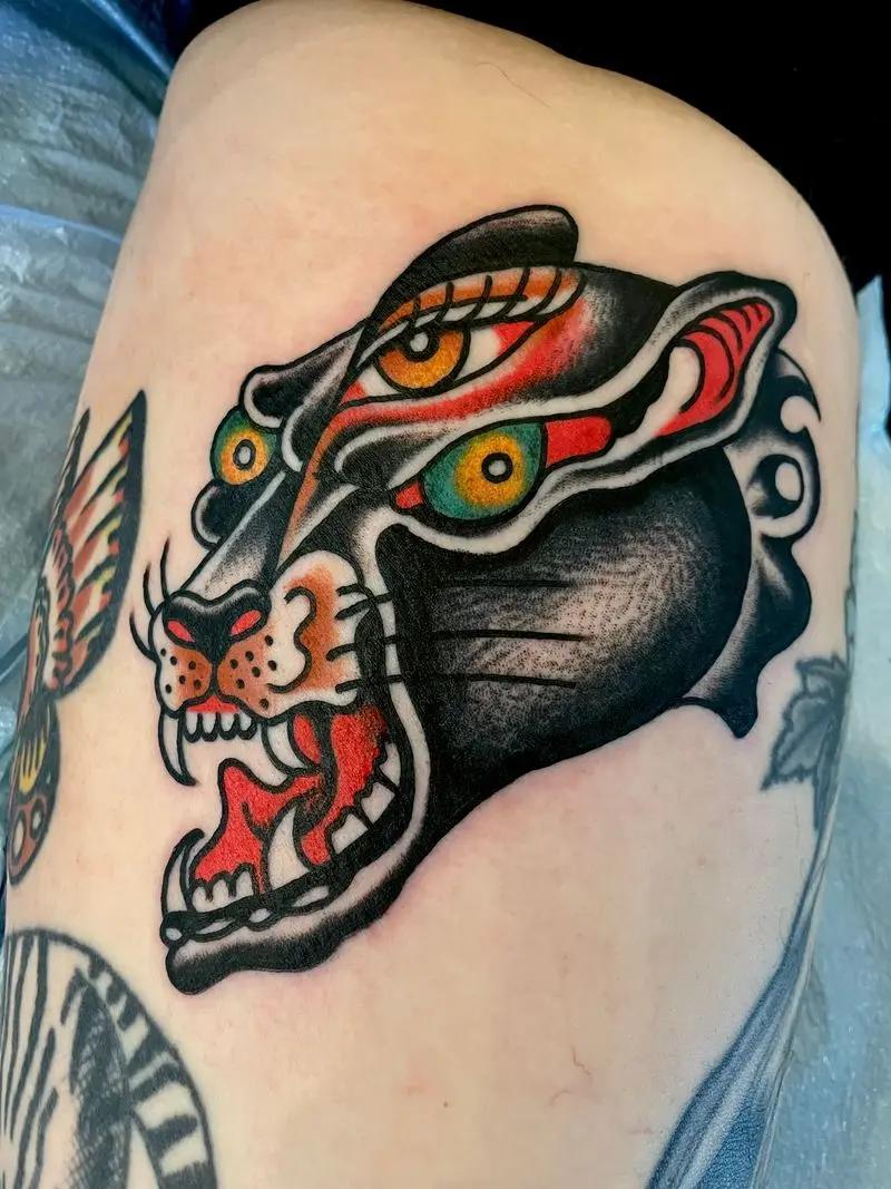 a tiger tattoo at the leg