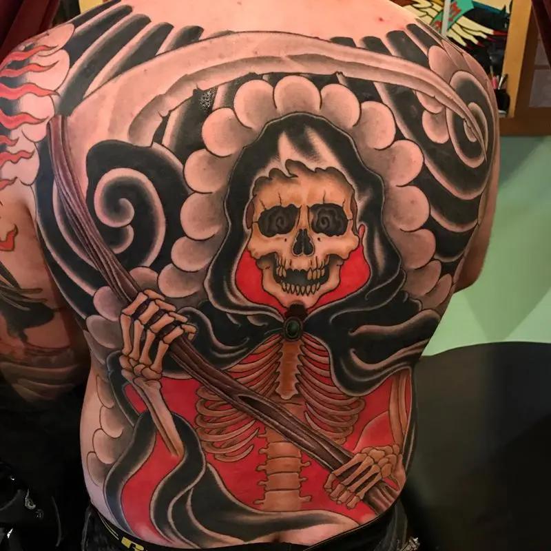 a back of a person with a tattoo