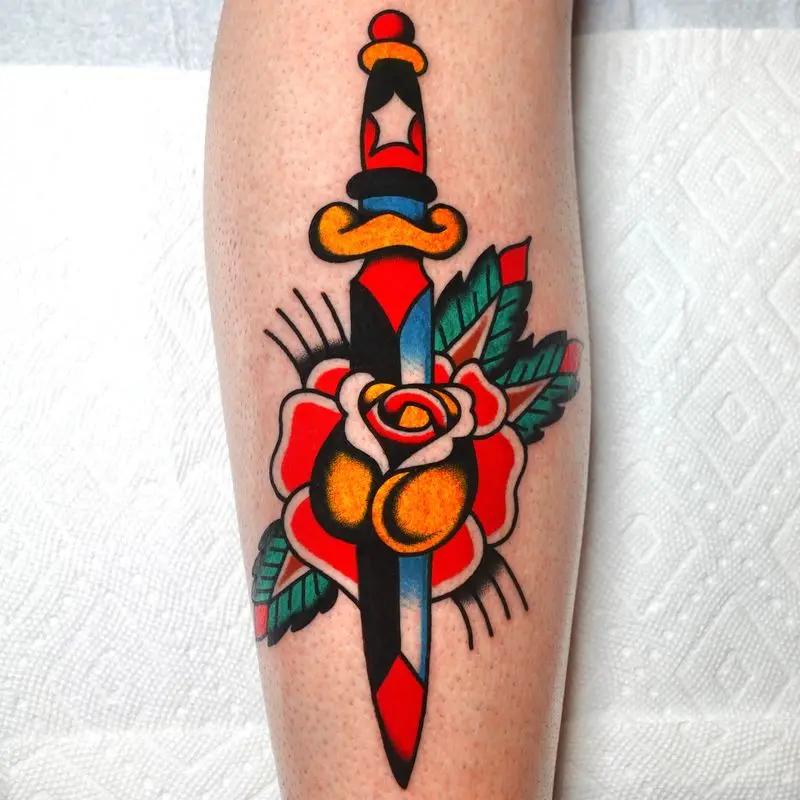 a knife and a rose tattoo