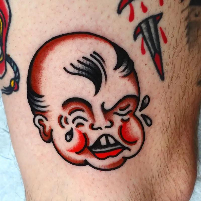 a baby-face crying tattoo