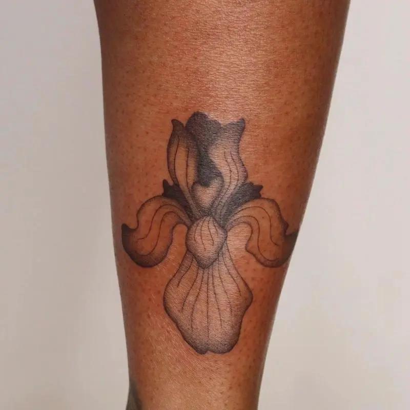 a floral tattoo on a leg