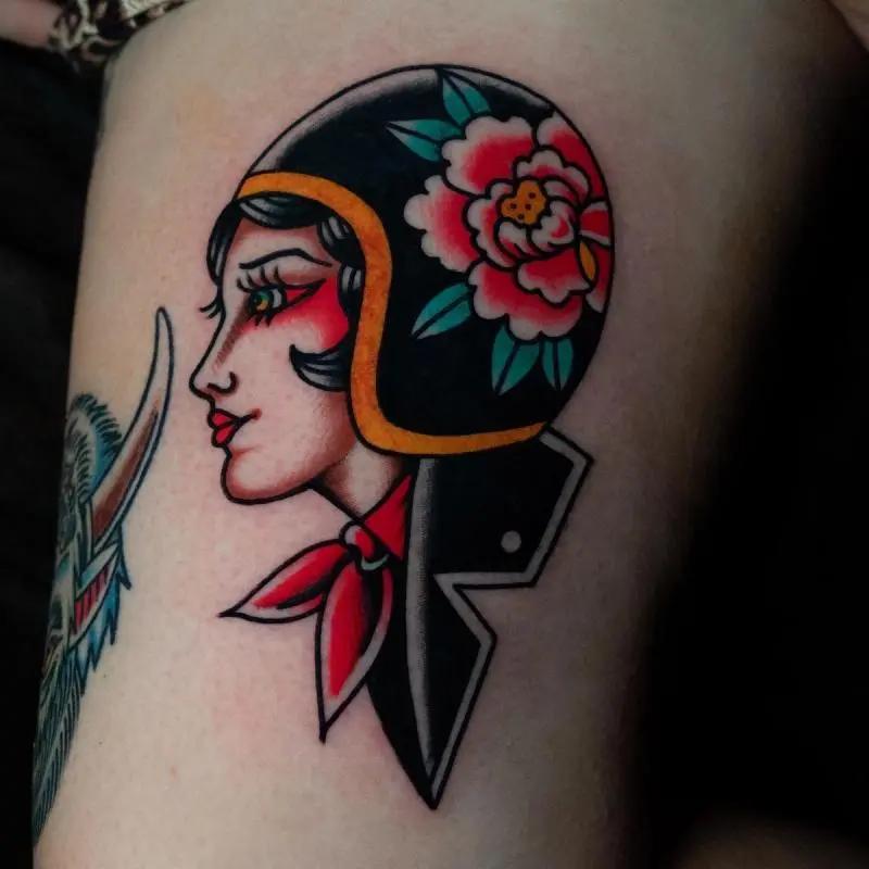 a woman wearing helmet tattoo